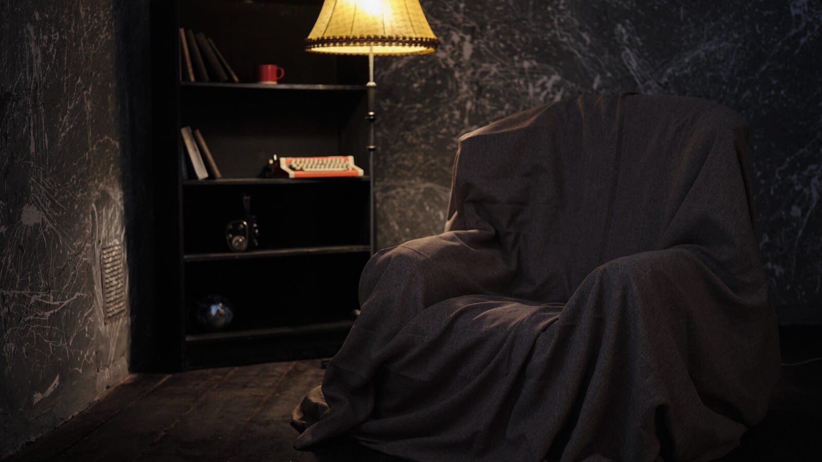 Dim bedroom with a warm lamp after a late scary movie